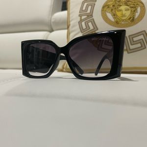 Absolutely beautiful YSL Sunglasses - just like new. Has case.  No scratches